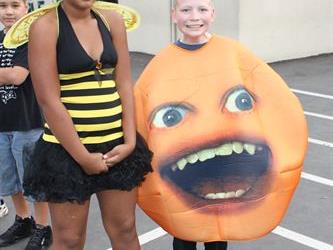 Students standing in line wearing costumes