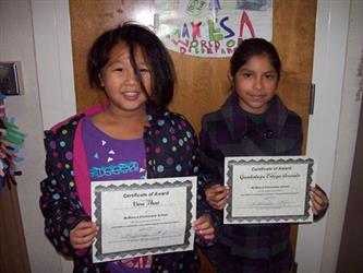 Students smiling and showing certificates