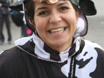 A teacher wearing a cow costume