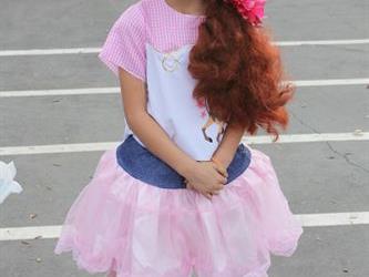 A student wearing a costume dress