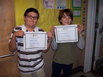 Students showing off awards